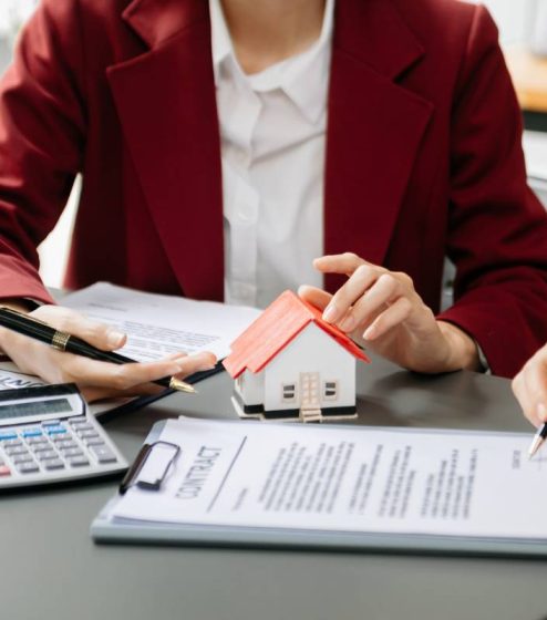 Considering buying a home, investing in real estate. Broker sign Considering buying a home, investing in real estate. Broker signs a sales agreement. agent, lease agreement, successful deal